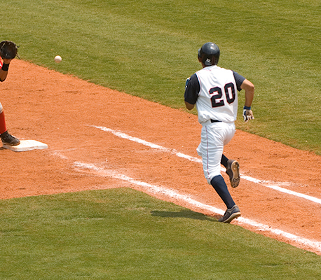 man playing baseball with an uniform in a baseball field