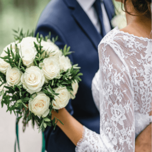 bride and groom with bouquet