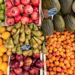 Pears Oranges pomegranates and other fruits at a farmers market
