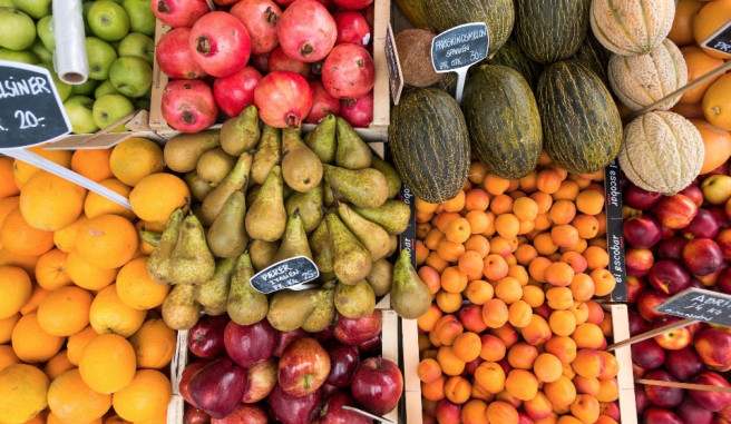 Pears Oranges pomegranates and other fruits at a farmers market