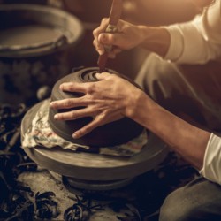 artist sculpting pottery
