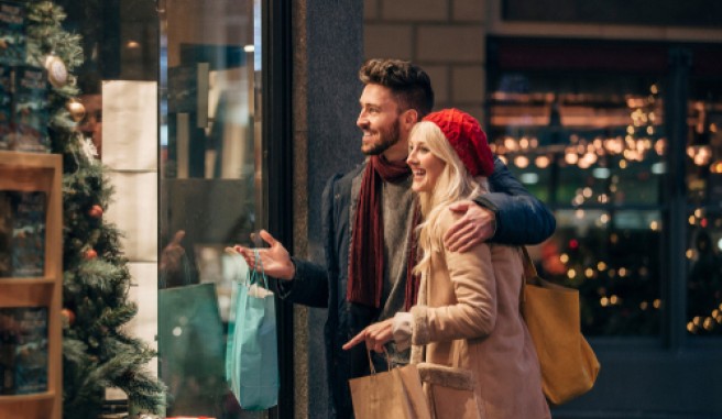 couple window shopping at christmas