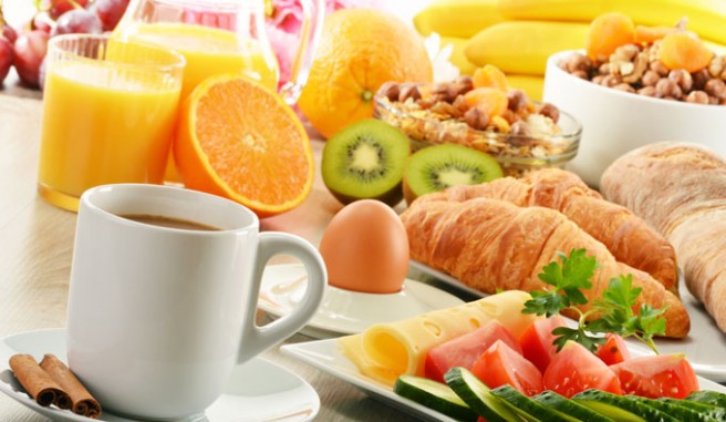 breakfast food displayed on table. Header