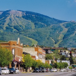 mountain view with small quaint city street, lined with historic brick stores