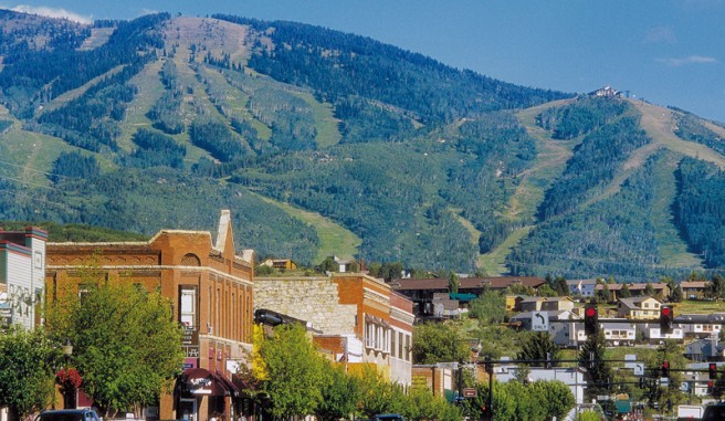mountain view with small quaint city street, lined with historic brick stores