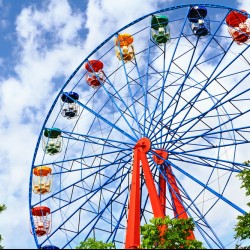 ferris wheel in front of a beautiful blue sky