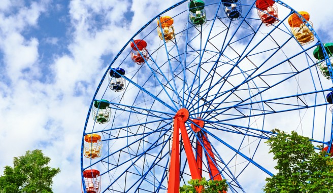 ferris wheel in front of a beautiful blue sky