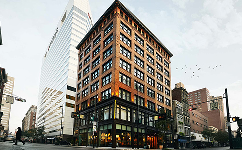 exterior of modern brick building with multiple stories