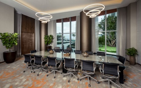 Atlantic Boardroom with long table and chairs, modern chandelier and large windows