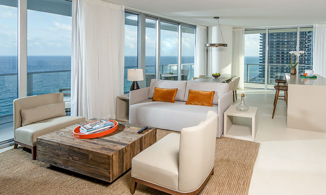 Deluxe Oceanfront at Hyde Hollywood Beach has full sitting area and floor to ceiling sliding doors on a a number of walls with ocean views