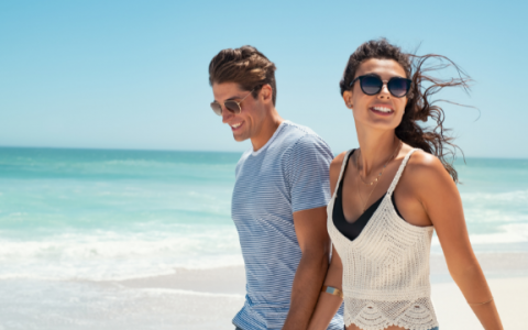 Couple smiling on beach 