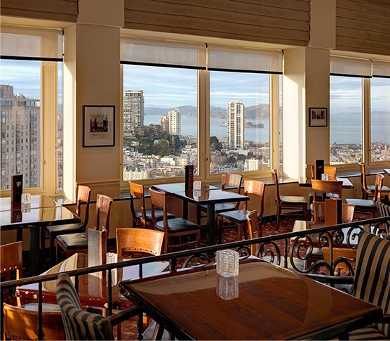 dining space with view of the city and ocean