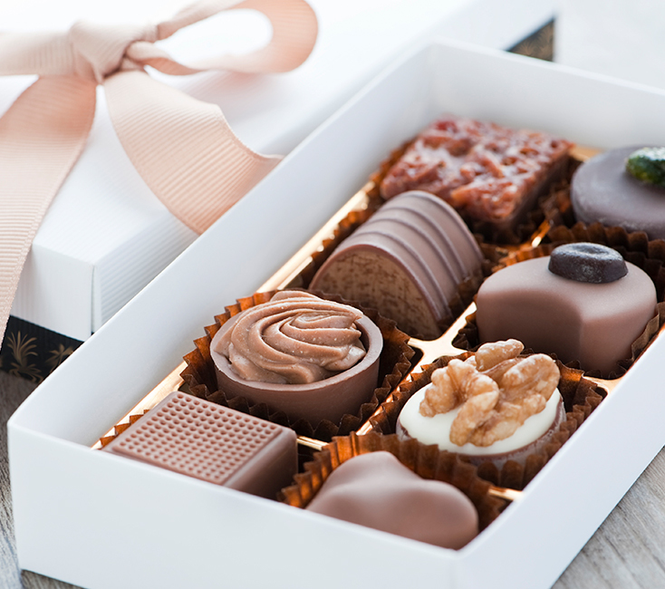 white gift box filled with eight chocolate truffles 