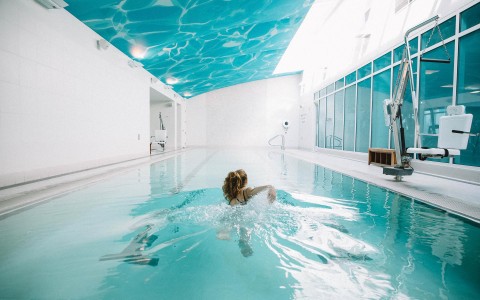 guests swimming at the indoor pool