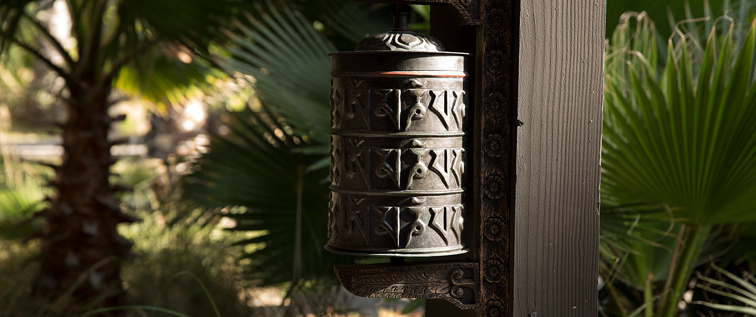 a metal bucket on a wooden pole outside