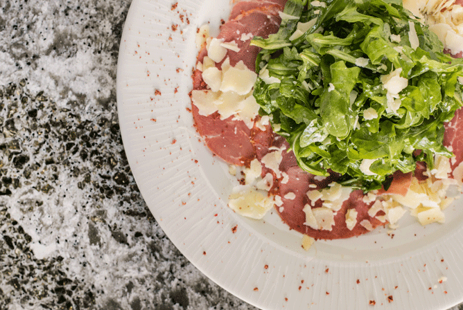 overhead view of a beef carpaccio dish
