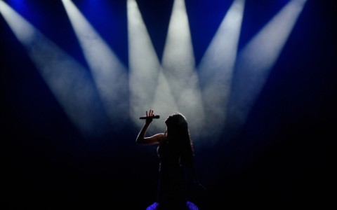 singer on stage with lighting