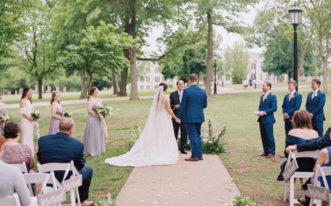 outdoor ceremony with bridge and groom