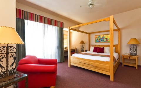 hotel bed room with 1 bed with a light wood frame