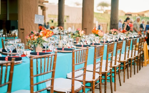 long table with covered with light blue table cloth 