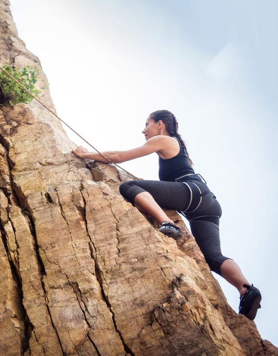 person rock climbing