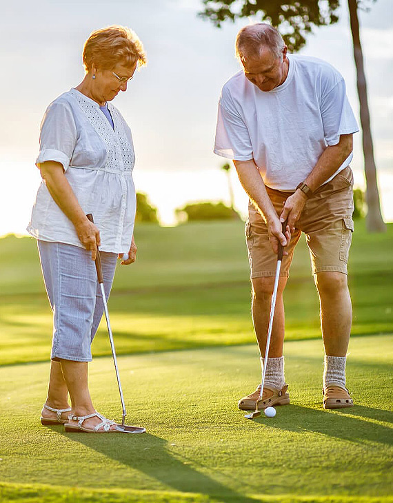 older couple golfing