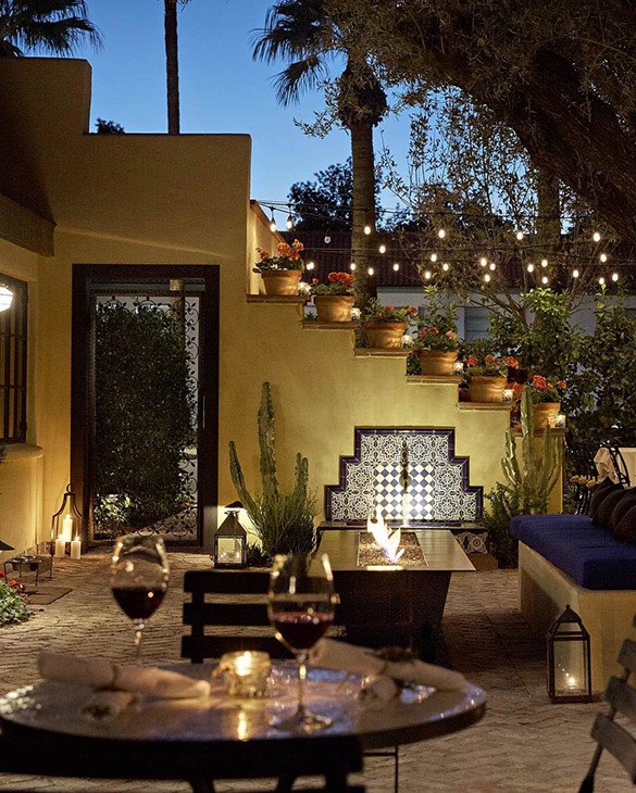 outdoor lounge and dining area with a firepit