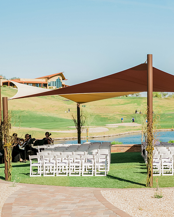 lawn chairs ready for wedding ceremony with live band to the side
