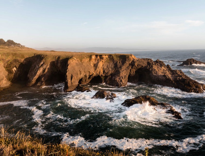 cliff with ocean and blue sky