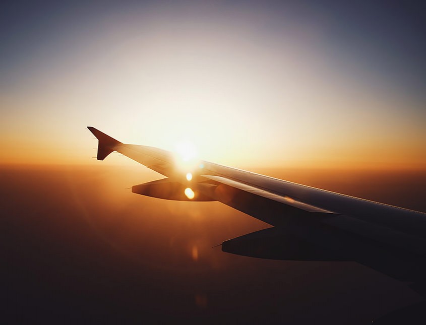 sun gleaming over a plane wing