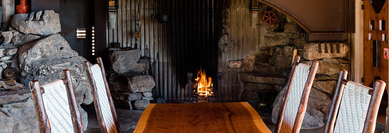 dining table near an indoor fireplace