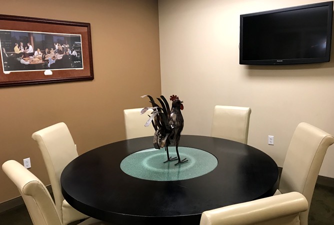conference table with rooster centerpiece