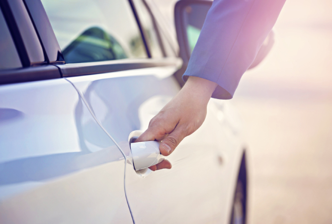 hand opening a car