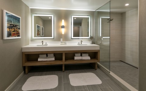 a guest bathroom with double vanity