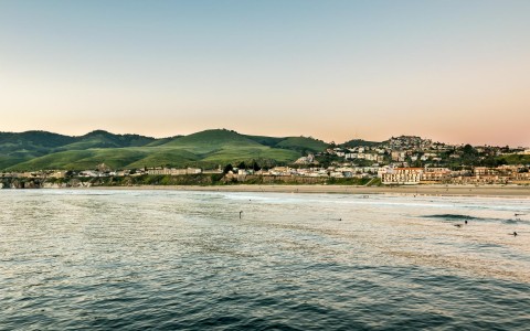 calm waters in pismo beach with view of city