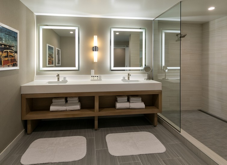 a bathroom in a suite with double vanity