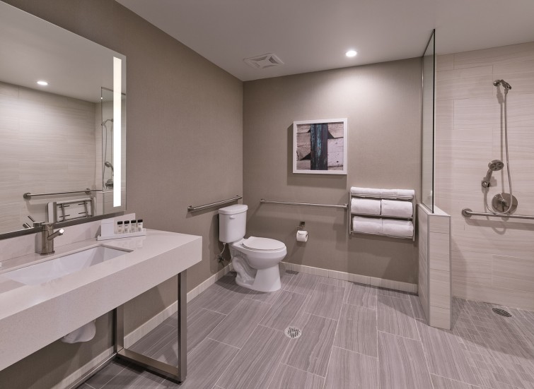 a guest bathroom with grey decor