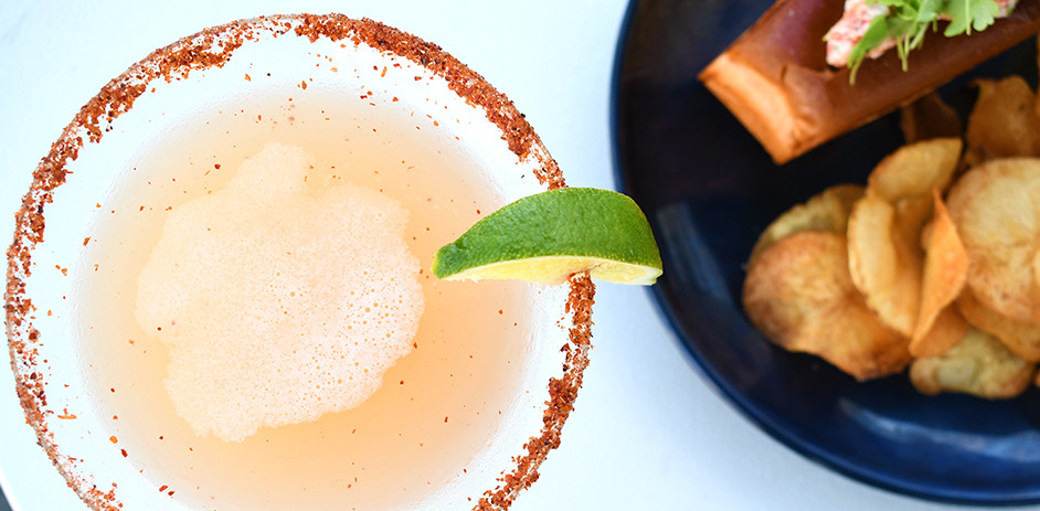 overhead view of cocktail and chips