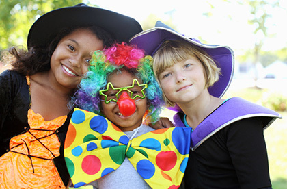 Three kids in halloween costumes