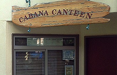 Cabana Canteen at Inn of the Hills outdoor signage, it is a plank of wood with red writing