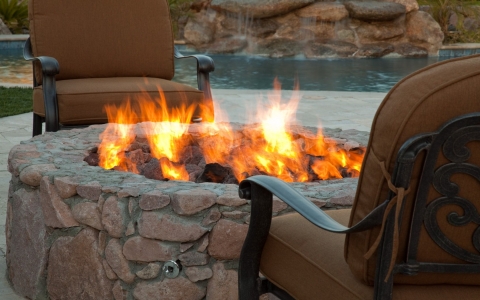 Two chairs at an outdoor fire pit