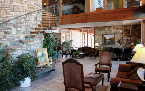 Hotel lobby area and spiral staircase at Inn of the Hills Hotel & Conference Center