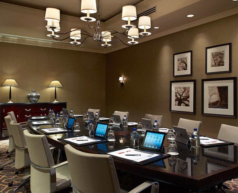 willard barclay boardroom meeting space with glass executive table and leather chairs