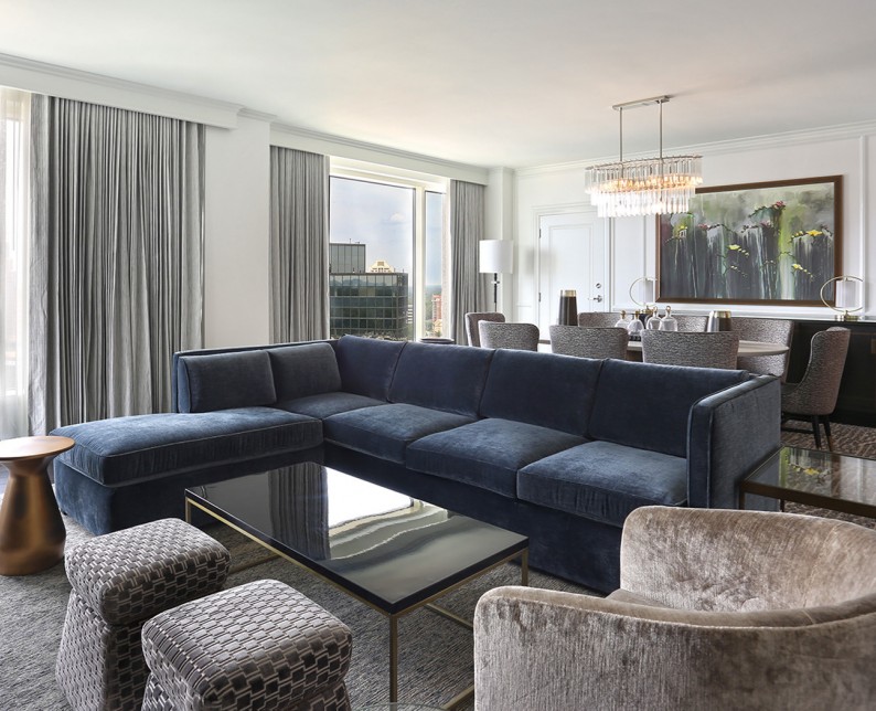 navy couch in elegant living area_ambassador suite