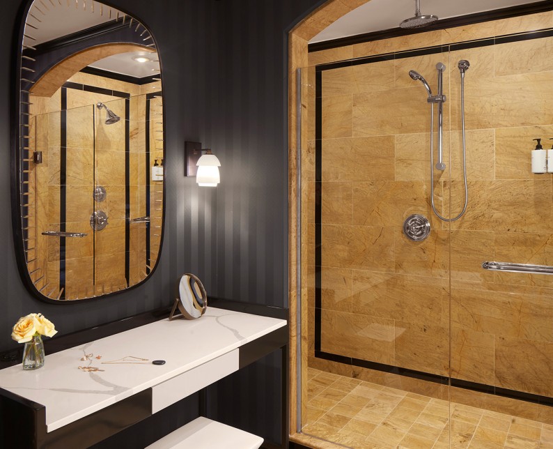 dark bathroom walls and gold shower