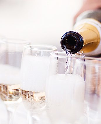 champagne being poured into a flute