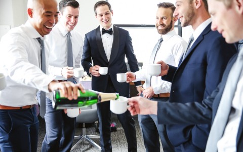 groom and groomsmen celebrating