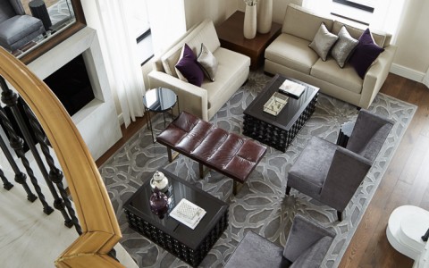 large suite with arm chairs, couches, and seating areas