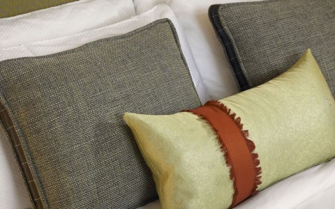 bed with a few pillows