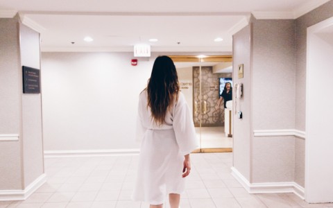 woman walking through spa lobby